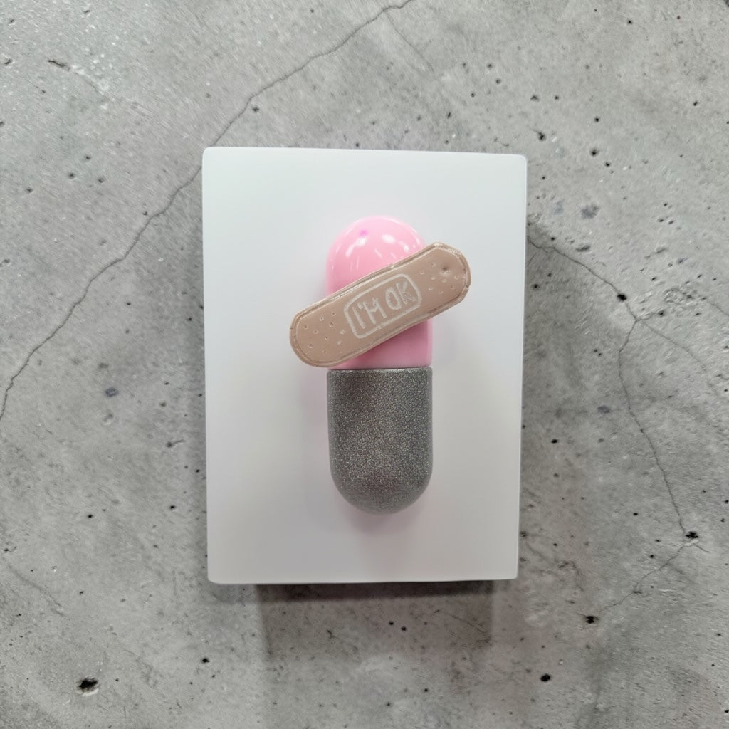 I’m Ok Capsule Pill Wall Art – 8x6” Resin Sculpture – Pink Pop Art Mental Health Piece – Glitter Silver & Bandage Detail – Ready to Hang