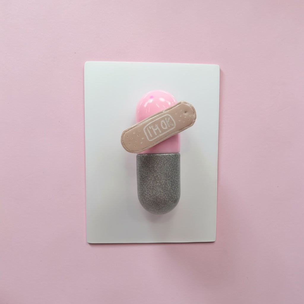 I’m Ok Capsule Pill Wall Art – 8x6” Resin Sculpture – Pink Pop Art Mental Health Piece – Glitter Silver & Bandage Detail – Ready to Hang
