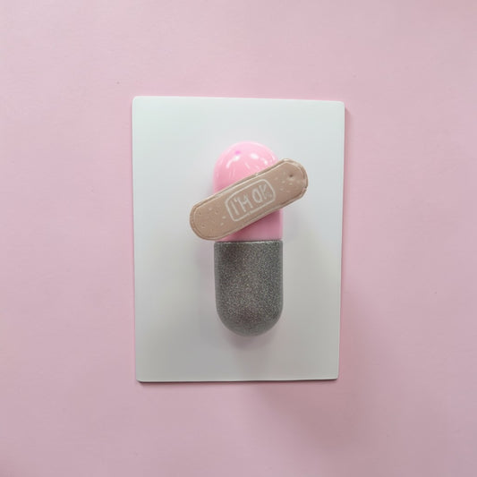 I’m Ok Capsule Pill Wall Art – 8x6” Resin Sculpture – Pink Pop Art Mental Health Piece – Glitter Silver & Bandage Detail – Ready to Hang
