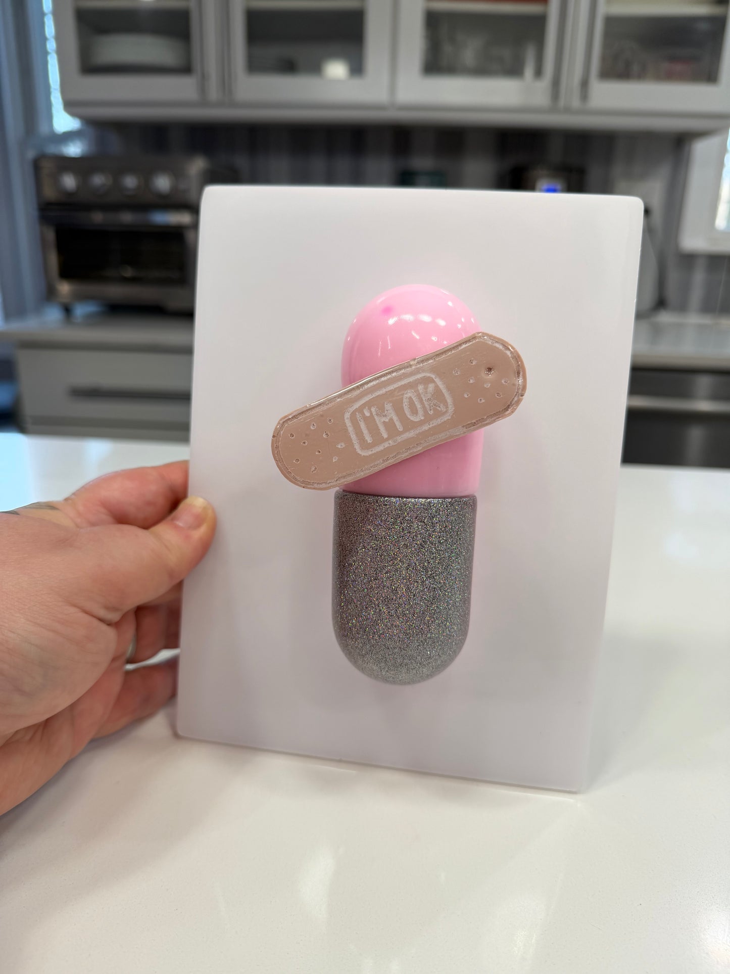 I’m Ok Capsule Pill Wall Art – 8x6” Resin Sculpture – Pink Pop Art Mental Health Piece – Glitter Silver & Bandage Detail – Ready to Hang